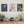 The photos “Midnight Snack” of a Becorn and chipmunk under glowing snowbells, “Cherry Blossom” of a Becorn in a weeping cherry tree, and “Monarch” of a Becorn looking at an emerging monarch butterfly, as metal prints mounted without frames on a pale gray wall. In the lower right corner of the prints, David Bird’s signature is visible. Underneath them is a sideboard with several potted plants.